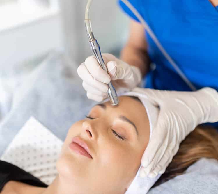 Dermal Therapy Treatment being applied to a womans face at Envisage Clinic