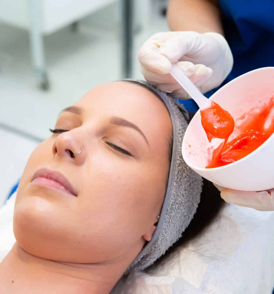 Acne Treatment applied to face of female patient